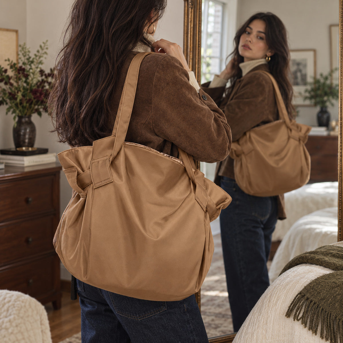 Woman carrying the tan Bodega Bag tote over her shoulder