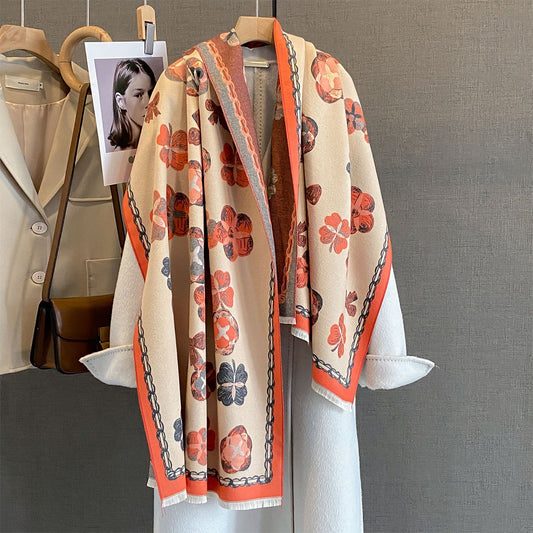 Soft tassel winter shawl wrap in orange draped over a coat
